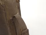 a brown bag that is sitting on a white surface