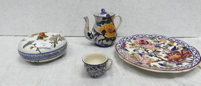 a table with a plate, cup, and saucer on it