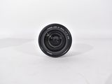 a close up of a camera lens on a white surface