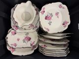 a stack of plates and bowls in a black box