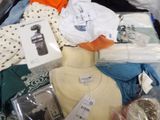 a suitcase full of clothes and other items in it