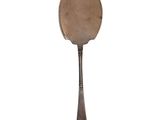 a silver spoon with a brown handle on a white background