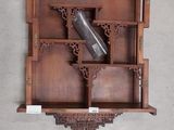 a wooden shelf with a wine bottle on top of it