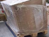 a pallet with a large box on it in a warehouse