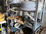 many different types of hoses on the shelves
