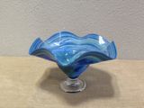a glass bowl that is sitting on a table