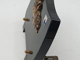 a statue of a man on a clock on a stand