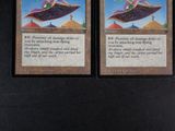 a picture of two cards with a picture of a person on a flying saucer