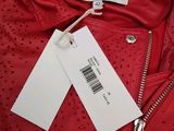 a close up of a red jacket with a tag on it
