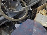 a car with a bunch of junk in the back of it