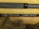 a close up of a fishing rod and a net on a table