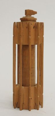 a small wooden structure with a bird on top