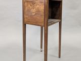 a small wooden table with a drawer on top of it