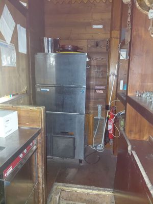 an image of a kitchen with a refrigerator and a stove