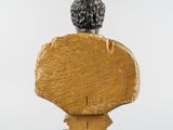 an image of a wooden bust of a man on a pedestal
