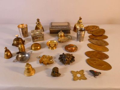 a lot of gold and silver items on a table