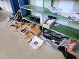 a green shelf with many items on it in a room