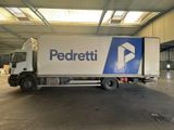 a delivery truck that is parked in a warehouse