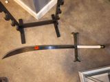 a sword that is laying on the floor next to a door