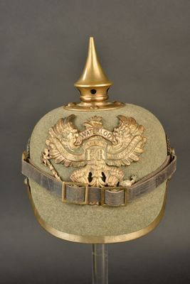 an old military helmet with a gold eagle on it
