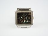 wrist watch on a white surface with a white background