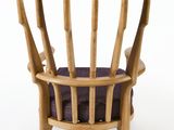 an image of a wooden chair with a purple cushion
