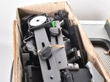 a box full of assorted electronic devices on a table