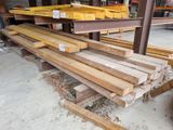 several pieces of wood are stacked on top of each other in a warehouse