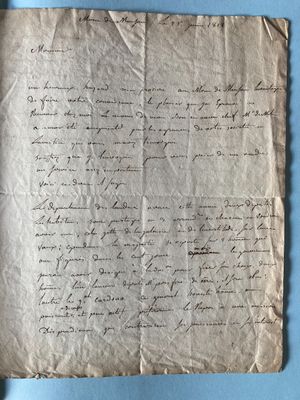 a piece of paper with writing on it sitting on a blue surface