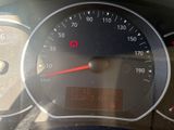 a close up of a speedometer on a car ' s dashboard