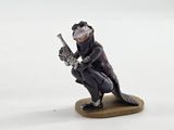 a figurine of a man with a gun on a white surface