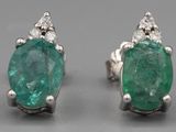 an image of a pair of emerald and diamond earrings