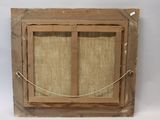 an old wooden window with a rope hanging from it ' s side