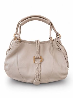 a close up of a handbag with a braid handle