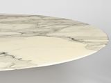 a marble table with a white top and a black base