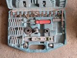 a blue tool box with tools in it on the floor