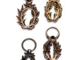 four different types of key rings with a skull and wreath on them