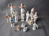 many figurines of people that are sitting on a table