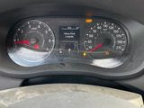 a close up of a car dashboard with a speedometer and gauges