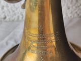 a brass bell that is sitting on a table