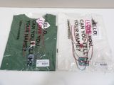 two t - shirts that have been wrapped up on a table