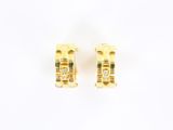 a pair of gold and diamond earrings