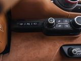 a close up of a car dashboard with buttons and controls