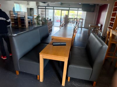 a man standing at a table in the middle of a room