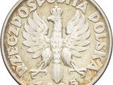 a close up of a silver coin with a bird on it