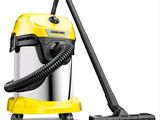 a yellow vacuum cleaner with a black hose on top of it