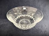 a glass bowl that is sitting on a table