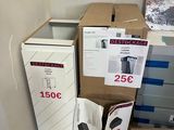 two boxes and a refrigerator in the corner of a room