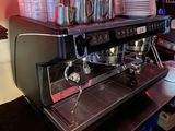 a coffee machine sitting on a counter in a kitchen