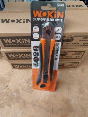 two boxes of wokin snap off blade knives sitting on a table